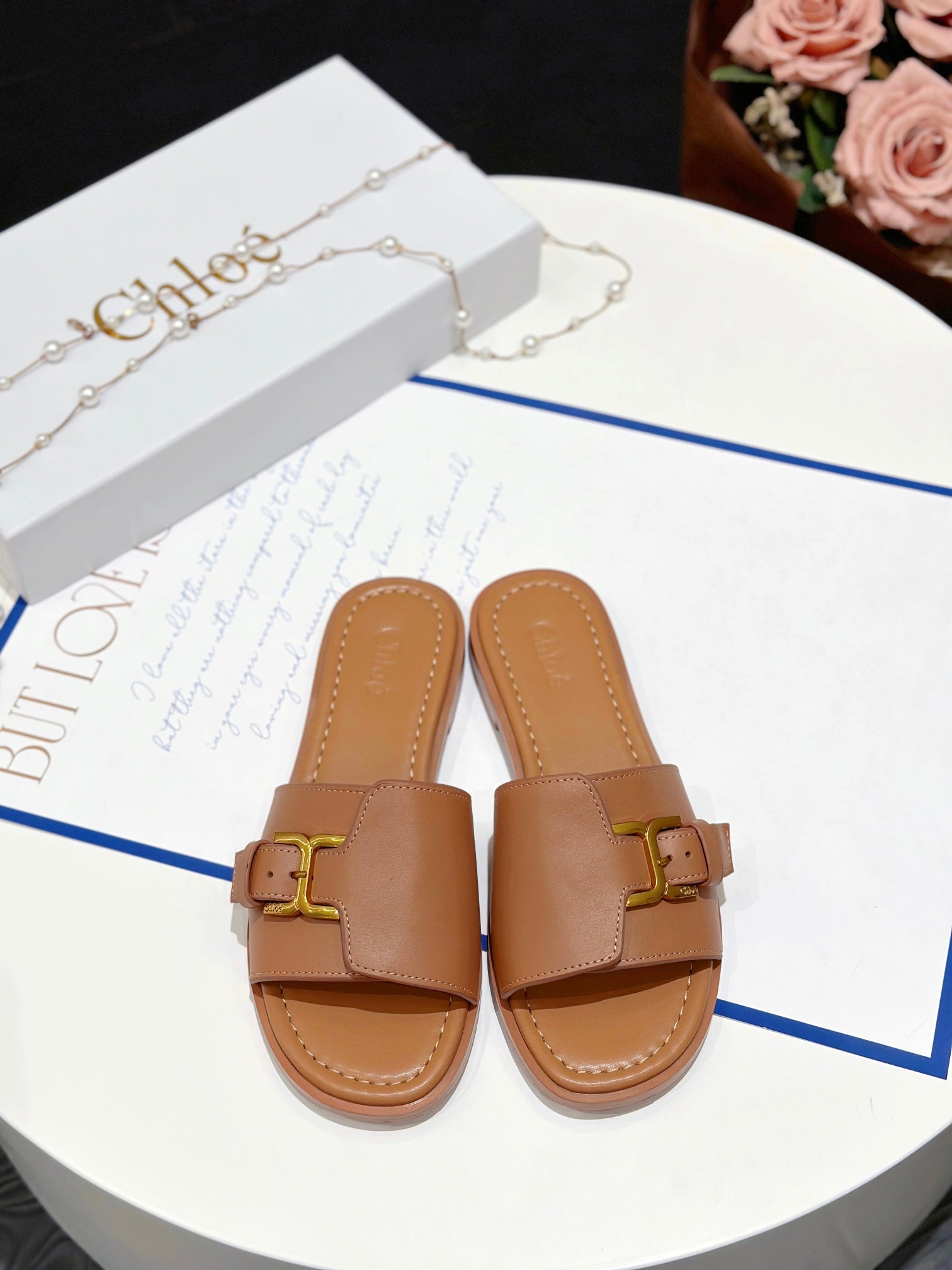 MARCIE SLIDE IN BRONZE BROWN CALFSKIN WITH GOLD HARDWARE