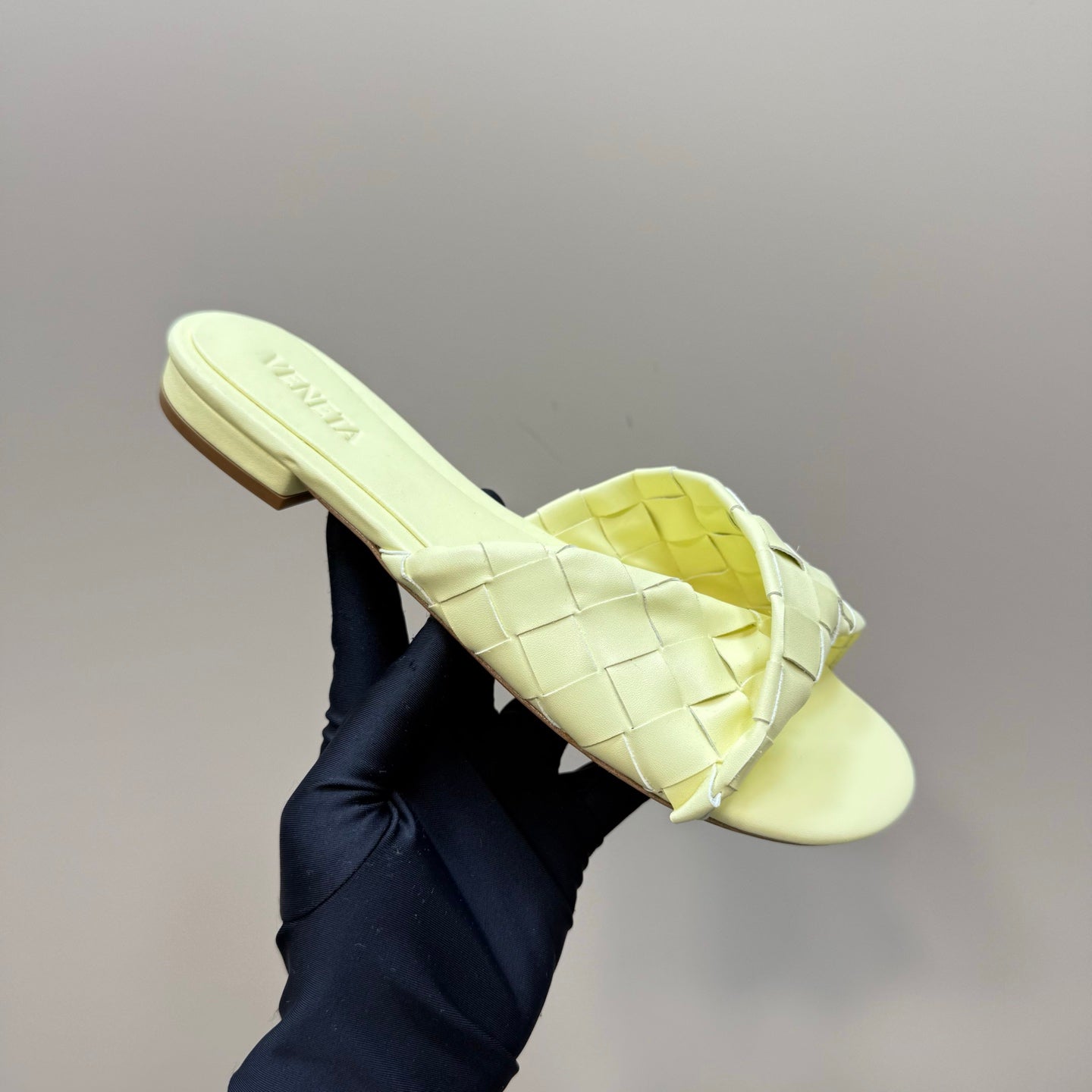 BOTTEGA VENETA BLINK FLAT MULE IN PASTEL YELLOW INTRECCIATO LEATHER
