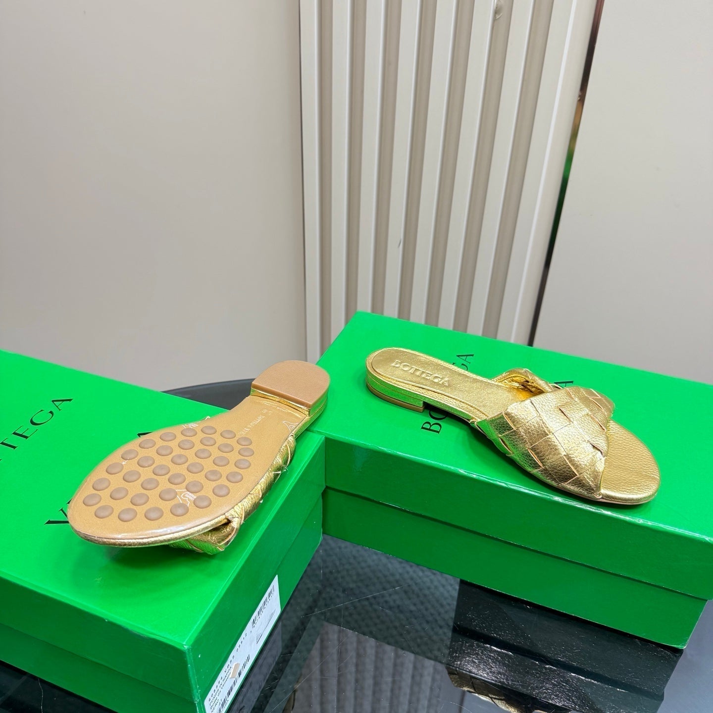 BOTTEGA VENETA BLINK FLAT MULE IN GOLD INTRECCIATO LEATHER